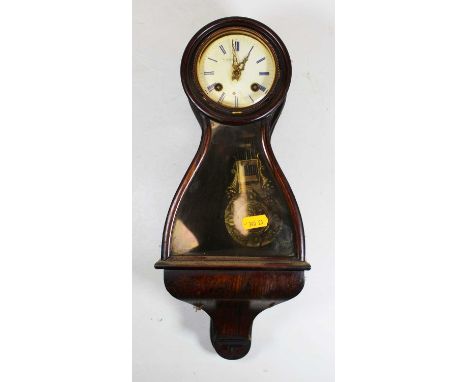 Malecot of Paris, a faux rosewood cased balloon shaped bracket clock having signed white enamel dial, twin winding holes for 