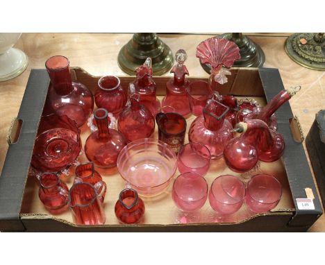 A collection of Victorian and later cranberry glass ware, to include entwined double oil bottle, a ruby glass vase etched 'Re