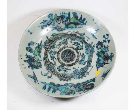 A large Chinese stoneware shallow bowl, enamel decorated with figures and animals within landscapes, dia.38cmCondition report
