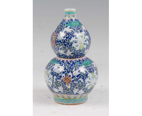 A Chinese export vase of double gourd form, enamel decorated with flowers, height 22cm