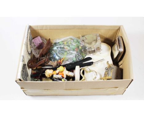 A box of miscellaneous items to include Hummel figure of a school girl, glove stretchers, inkwell, etc