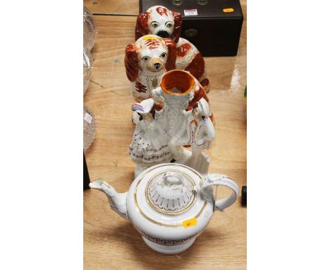 A Victorian teapot, on a plain white ground, having gilt decoration; together with a Staffordshire flatback figure of a Highl
