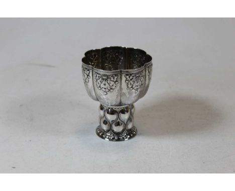 An Edwardian silver communion goblet, having melon shaped bowl with repousee floral decoration, 4.3ozCondition report: Condit