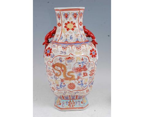 A Chinese export vase of shaped octagonal form, enamel decorated with a gilt dragon with further enamelled floral decoration 