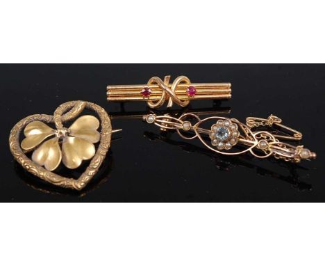 A 15ct gold and ruby set bar brooch, 2.3g, 36mm; together with an Edwardian 9ct gold, blue topaz and seed pearl set openwork 