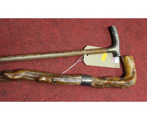 An early 20th century silver handled walking stick, 85cm, together with another walking stick with a silver collar, 84cm