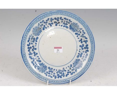 A Chinese export blue &amp; white plate having typical underglazed blue floral decoration with blue seal mark verso, dia. 27c