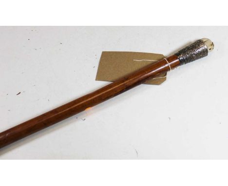 A late 19th/early 20th century gentleman's walking stick, the white metal handle surmounted by a resin model of a rabbit, 93c