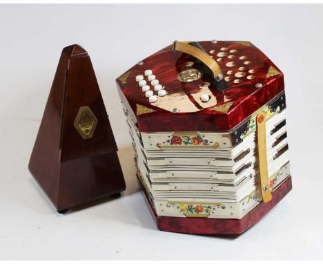 A German Scholer accordion together with a French Paquet mahogany cased metronome, height 23cm