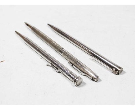 A modern engine turned silver cased ballpoint pen; together with a silver lifelong propelling pencil; and a white metal cased