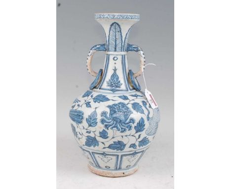 A Chinese export blue &amp; white vase having a flared rim to a slender neck with elephant trunk handles and bulbous lower bo