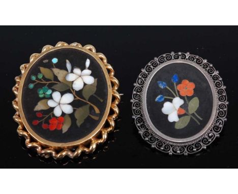 Two pietra dura brooches, the first oval brooch inset with floral decoration collet mounted with rope twist border, in unmark