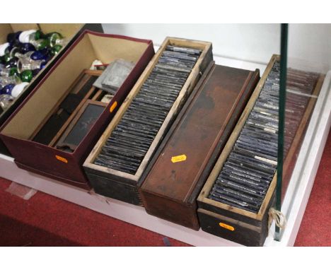 Four boxes containing a collection of various magic lantern slides to include several architectural examplesCondition report: