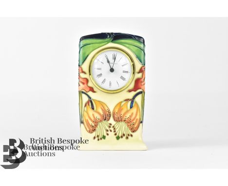 Moorcroft clock, Tiger lily design, approx 9.5 w x 16 h cms, white enamel face with Roman dial, factory marks to base, AA, da