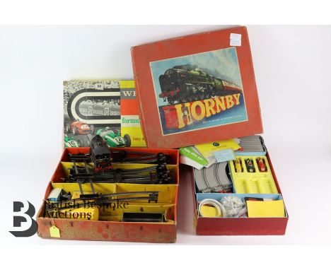 A boxed Hornby clockwork train set, and a Wrenn Formula 152 Triple Electric model motor car racing set, in the original box.&