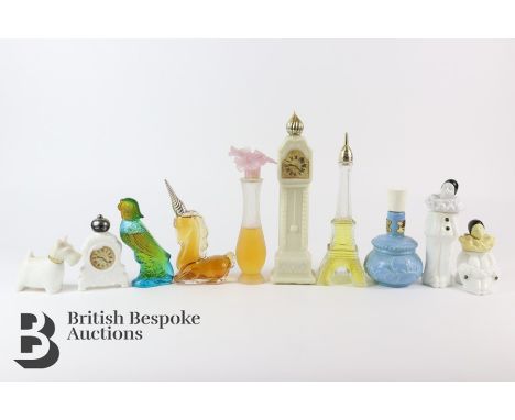 Collection of vintage Avon perfume and cologne bottles, including cars, two pheasant, bulldog, Eiffel tower, parrot, Perot, L