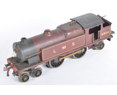 A vintage Hornby O gauge 20V electric model railway trainset locomotive engine. The loco being a 4-4-2 LMS 6954 example with 