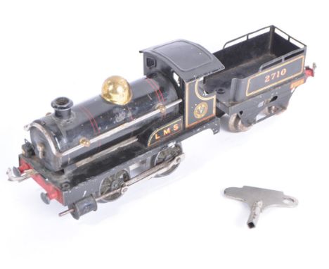 A vintage Hornby O gauge tinplate clockwork locomotive engine No. 1. The loco a 0-4-0 example in LMS black livery with 2710 t