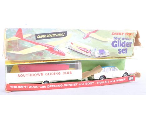 An original vintage Dinky Toys diecast model No. 118 Tow Away Glider set. The set containing a Triumph 2000 with opening bonn