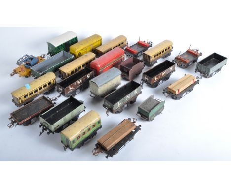 A large collection of assorted vintage Hornby and other O gauge tinplate model railway trainset rolling stock wagons and coac