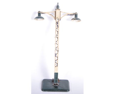 A pre war Hornby O gauge tinplate model railway trackside electric lamp standard No. 2E. Dark green base with plug socket fit