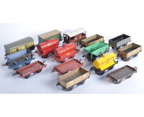A collection of vintage Hornby O gauge tinplate model railway rolling stock wagons to include; coach wagon, Motor Shell tanke