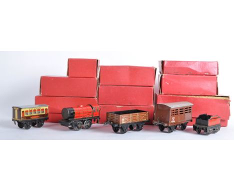 A collection of vintage Hornby Series O gauge model railway trainset locomotive wagons and trackside accessories. Examples to