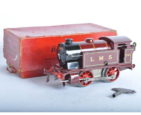 A vintage Hornby O gauge tinplate clockwork model railway trainset locomotive engine. The tank loco being a 0-4-0 LMS No. 211