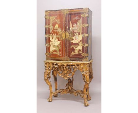 18TH CENTURY STYLE CHINOISERIE LACQUER CABINET ON OPENWORK STAND, the cabinet with a pair of doors decorated with figural lan