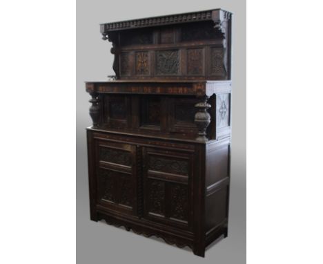 OAK COURT CUPBOARD, the canopy above an inlaid panel inscribed Ye XXV Daye Januarie 1640 between carved panels and the initia