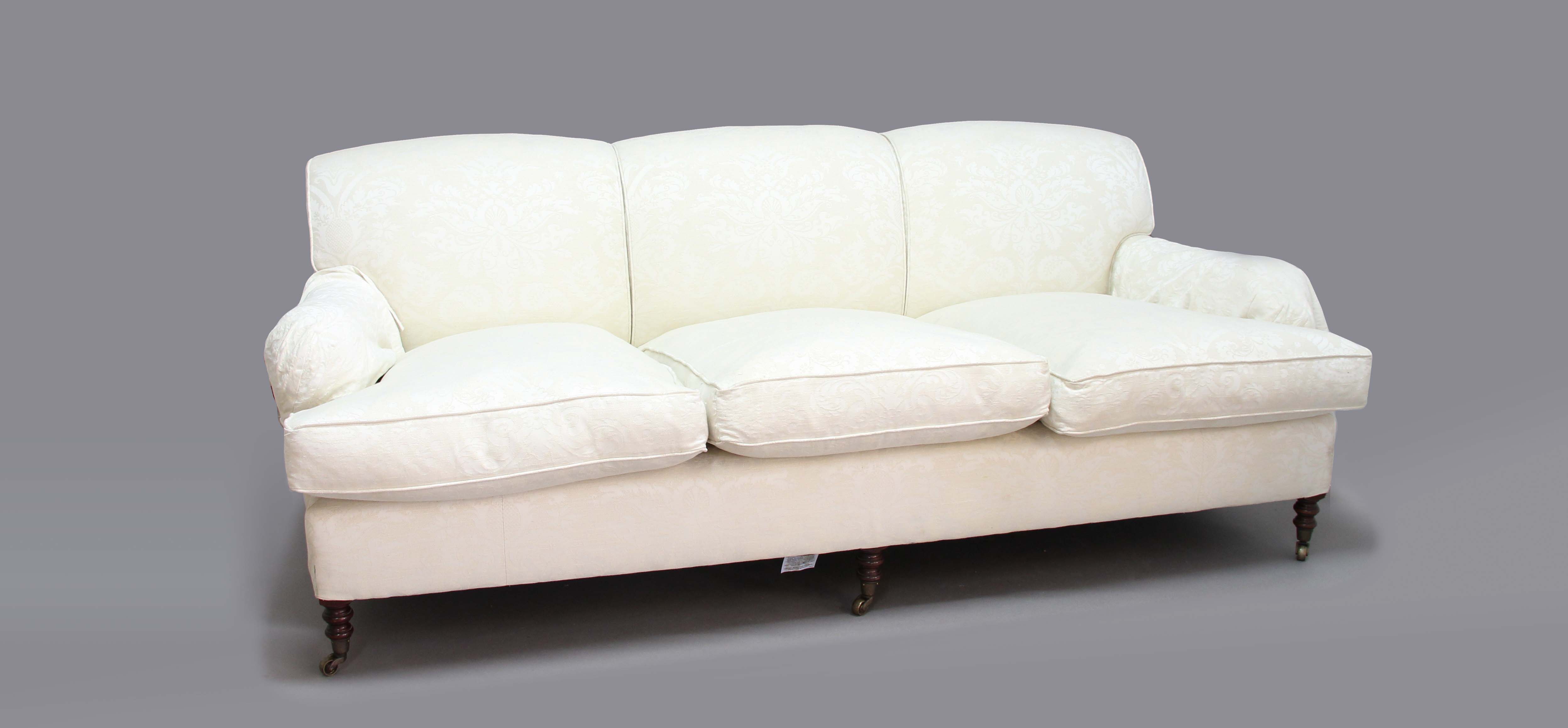 SMITH SOFA, in the Howard style, with linen coloured upholstery