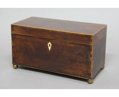 GEORGE III MAHOGANY TEA CADDY, of rectangular form, the interior with twin lidded compartments and central cut glass mixing b