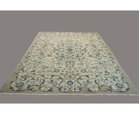KASHAN CARPET, Central Iran, circa 1965, the duck egg blue field of scrolling vines around a medallion framed by floral borde