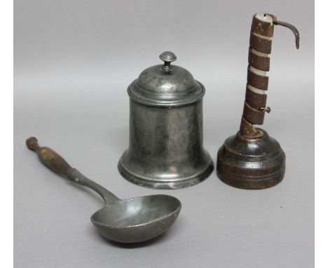 17TH CENTURY COURTING CANDLESTICK, with ejector and fruitwood base, height 20cm; together with a pewter ladle and lidded stor
