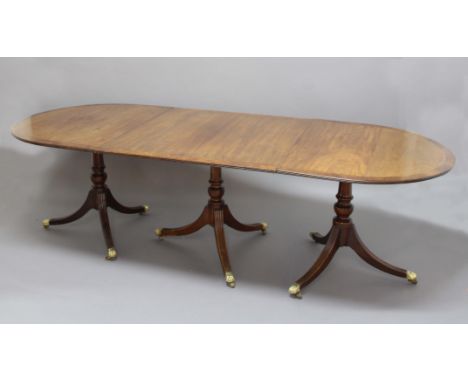 GEORGE III MAHOGANY AND BURR WALNUT THREE PILLAR DINING TABLE, the top with a pair of D ends and a central rectangular table 