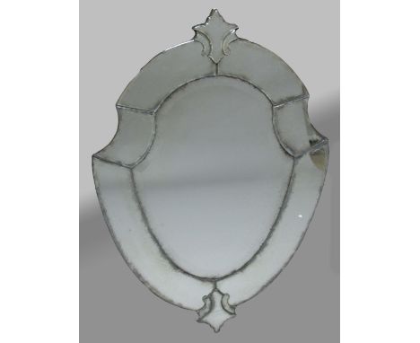SHIELD SHAPED VENETIAN MIRROR, the bevelled plate inside a broad frame with stylised floral finial and terminal, height 109cm