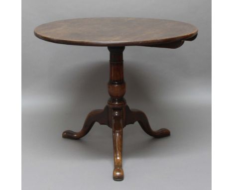 GEORGE III CIRCULAR OAK TILT TOP TABLE, on turned column and tripod base, height 74cm, diameter 89cm