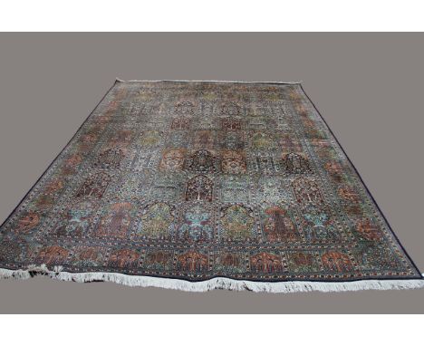 KASHMIR SILK PILED CARPET, North West India, circa 1960, the polychrome compartmentalised field with columns of Mihrab each e