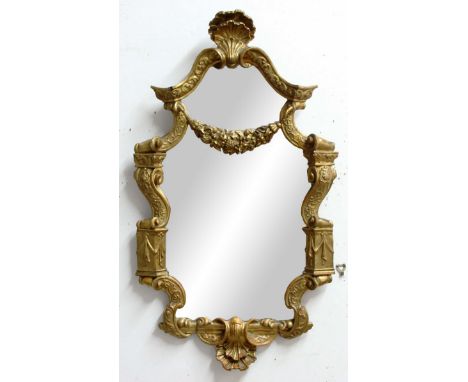 FRENCH GILTWOOD MIRROR, 19th century, the shaped plate beneath a smaller, cartouche plate, shell finial, fruiting floral swag