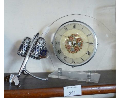 Art Deco perspex and chrome mantle clock together with a 1950s "space race" chrome climbing jet cruet set