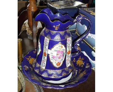 Blue and gold glazed jug and basin with floral panels
