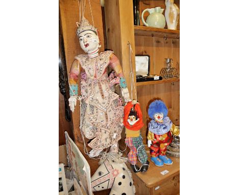 Vintage Indonesian marionette puppet, two clown puppets (one clockwork), and a hobby horse toy