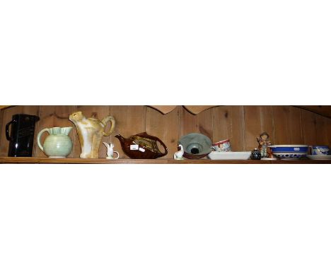 Carlton Ware Cat and Mouse teapot, Art Deco T-Flo teapot, Goebel Hummel boy with violin figure and other items (one shelf)
