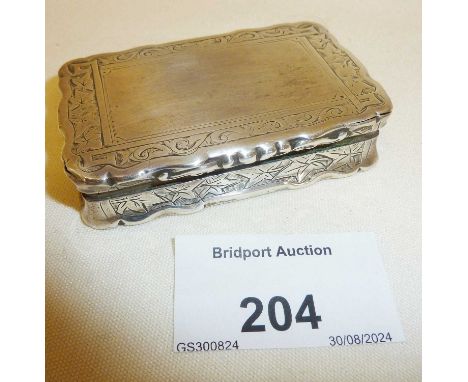 Victorian silver snuff box with foliate engraving. Hallmarked for Birmingham 1879. Maker George Unite (box not opening fully)