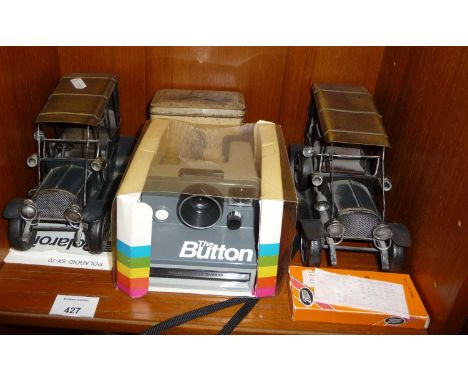 Polaroid camera, two metal veteran car models and a 1st Edition of "9-11 - a tribute"