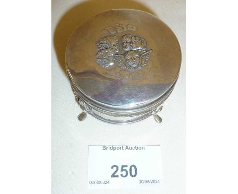 Art Nouveau silver trinket or ring box, with velvet lining. With repoussé winged cherubs to lid, and hallmarked under as Birm