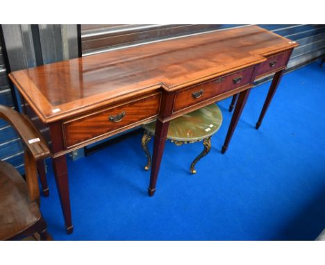 A good quality reproduction yew wood breakfront console table having square tapered legs and spade feet