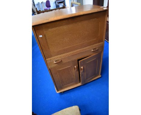 A vintage golden oak Ercol style bureau by Priory