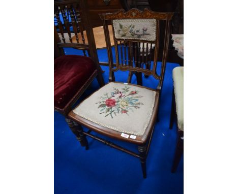 An Edwardian mahogany and inlaid bedroom chair having tapestry seat and spindle back