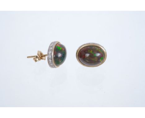 Pair black opal and diamond earrings, each with oval cabochon black opal measuring approximately 10 x 8 x 5mm, in gold settin